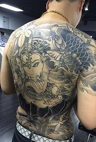 Full back with black and white personality totem tattoo