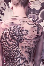 a ferocious black-and-white tiger tattoo