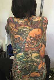 Short hair girls can also hold a full back tattoo pattern