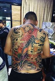 Full back tattoo with lotus and squid