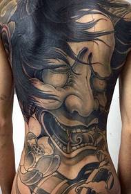 a large prajna tattoo that covers the entire back