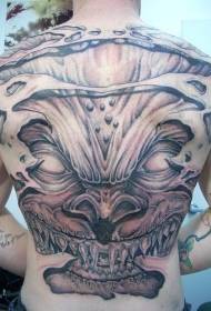 Ostra, nazobčana tetovaža demonske osebnosti na hrbtu