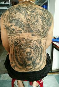 Male domineering full back dragon tiger tattoo