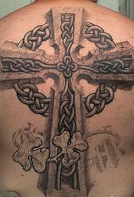 Men's back cross tattoo