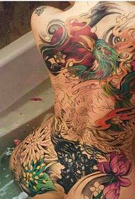Sexy beauty in the bathtub full of colorful phoenix tattoo designs
