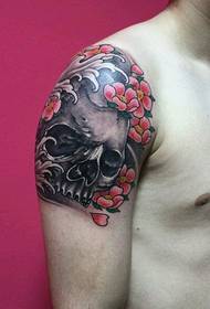 super cool skull floral tattoo