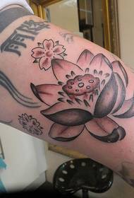 arm lotus dotted small flower Chinese tattoo