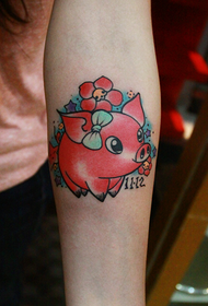 girls arm on the cute pig tattoo