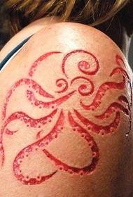 angling on the arm of the alternative octopus Totem cut meat tattoo