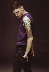 male model arm personality skull rose tattoo