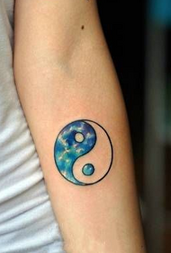 blue gossip figure arm tattoo