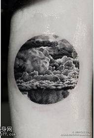 cloud tattoo on the arm