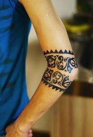 male arm Polynesian totem tattoo