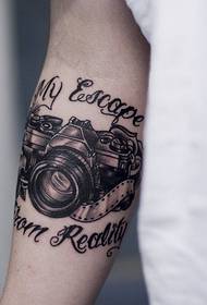 very individual arm camera tattoo