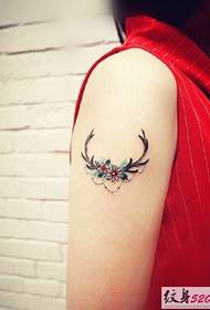 Simple antler tattoo on the arm