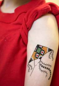a colored kite on the arm