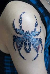 blue spider on the right arm Totem Tattoo