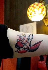 swallow angel arm tattoo