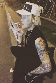 street fashion short hair female arm tattoo