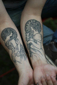 coppia tatuaggio religioso testa braccio