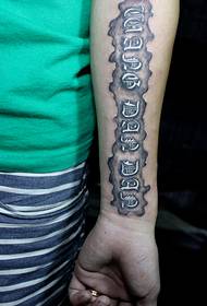arm letter tattoo