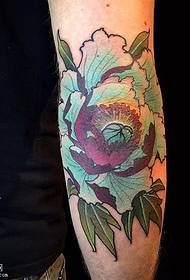 a beautiful peony tattoo pattern on the arm