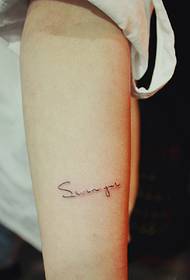 simple English tattoo on the girl's arm