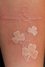 arm simple flower and English word invisible tattoo