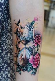 flowers are placed on the floral dress girl's arm on the flower tattoo