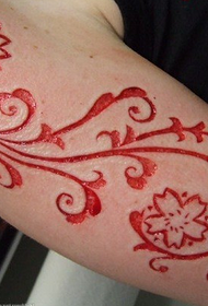 arm flower vine cut meat tattoo