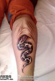 A thrilling snake into the skin with a tattoo pattern