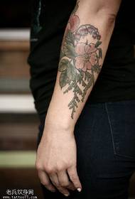 Beautiful botanical floral tattoo pattern on the arm