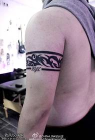 Arm point thorn around bohemian tattoo pattern