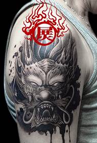 Arm domineering dragon head tattoo