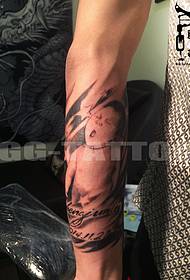 Arm baby portrait tattoo