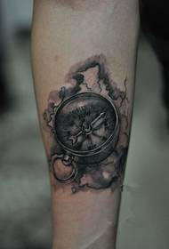 Stylish arm compass tattoo