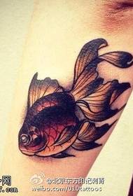 Realistic little goldfish tattoo on the arm
