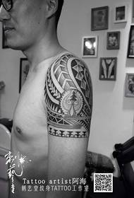 Big arm totem tattoo