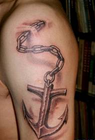Metallic anchor tattoo on the boom