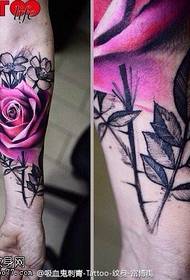 Twisted hot rose tattoo on arm