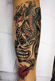 Winged tarragon tattoo on the arm