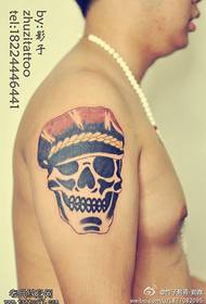 Arm stinged cap, small skull tattoo pattern