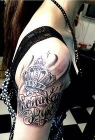 Fashionable female arm fine looking crown letter tattoo picture