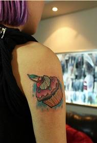 Female arm fine looking cake tattoo pattern picture