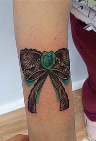 Beautiful female arm bow tattoo picture to enjoy pictures