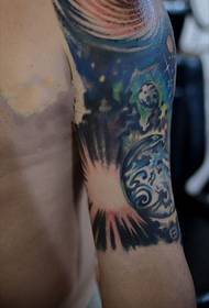 Cosmic star personality arm tattoo picture