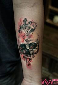 Creative skull with clock arm tattoo pictures