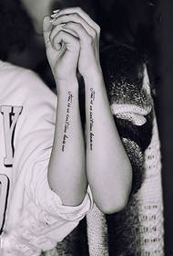 Long couple English tattoo on arm
