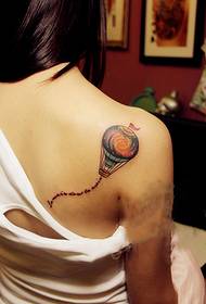 Girl color hot air balloon arm tattoo picture