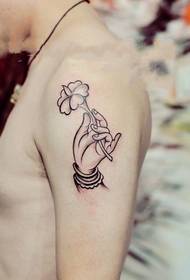 Arm mode bergamot lotus tattoo foto